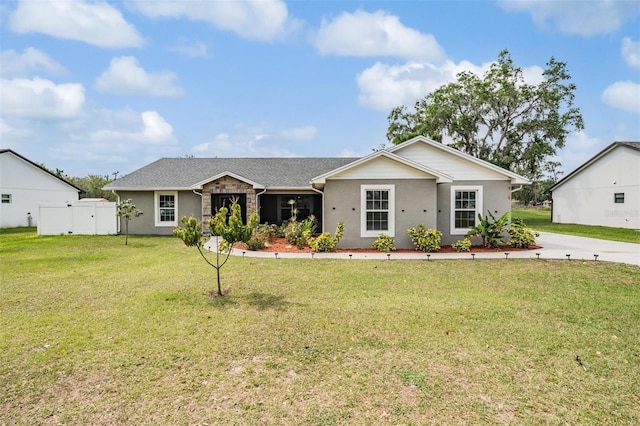 ranch-style house with fence, a front lawn, and a gate