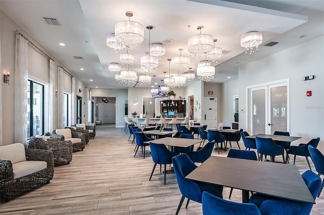 dining area featuring visible vents, recessed lighting, french doors, and light wood-style floors