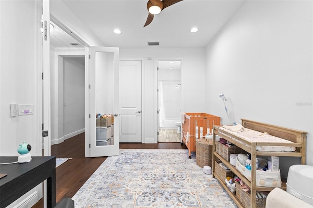 bedroom with visible vents, recessed lighting, baseboards, and wood finished floors