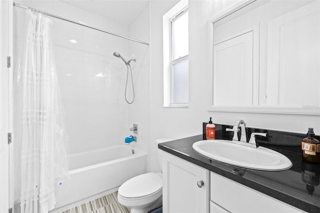 bathroom with toilet, vanity, and shower / bath combination with curtain