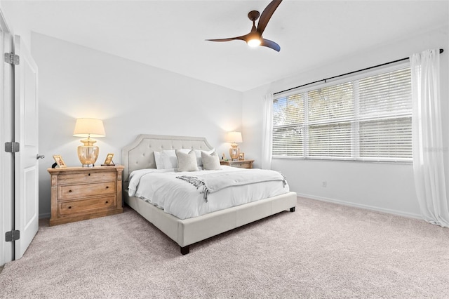 bedroom with baseboards, a ceiling fan, and carpet flooring