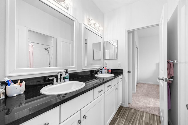 bathroom with double vanity and a sink