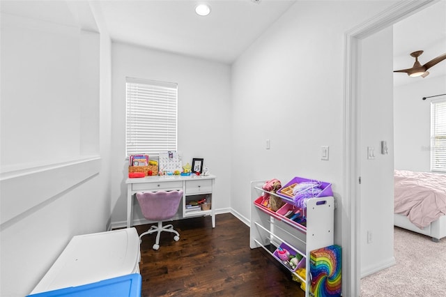 interior space with baseboards and wood finished floors