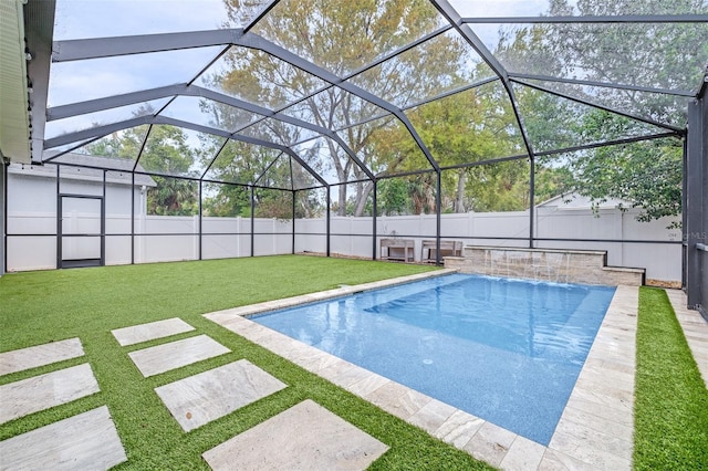 view of pool featuring a lanai, a fenced in pool, a lawn, and a fenced backyard