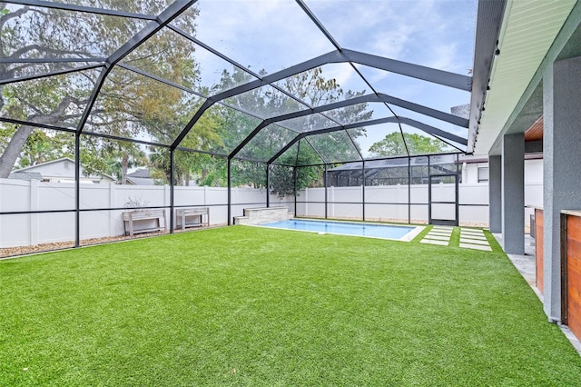 view of yard featuring a lanai, a fenced backyard, and a fenced in pool