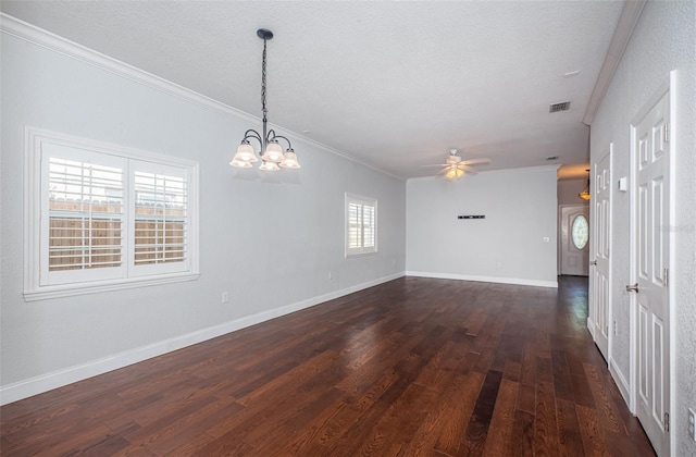 interior space featuring visible vents, crown molding, baseboards, dark wood finished floors, and a textured ceiling