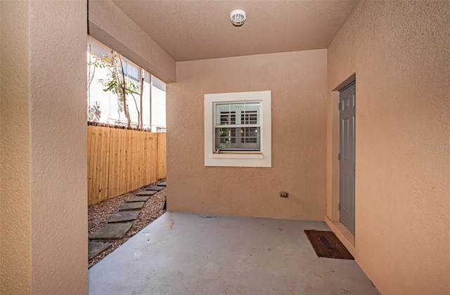 view of patio / terrace featuring fence