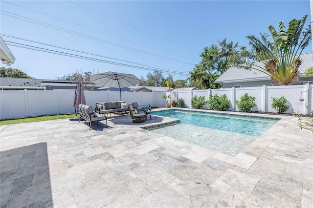 view of pool featuring a fenced in pool, a fenced backyard, outdoor lounge area, and a patio area