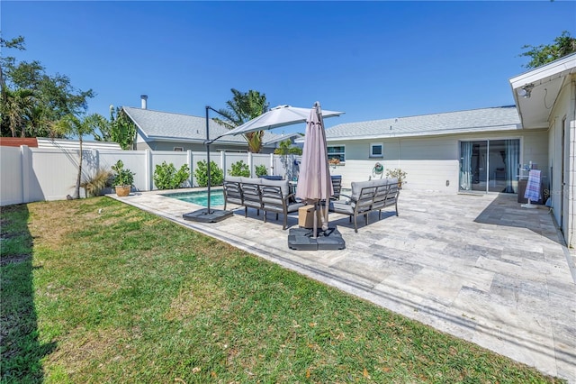 view of patio featuring an outdoor living space and a fenced backyard