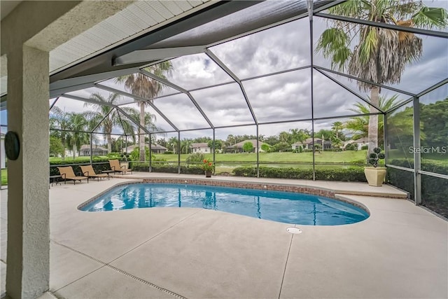 pool featuring a lanai and a patio