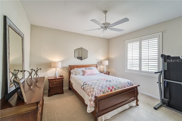 bedroom with ceiling fan, baseboards, and carpet