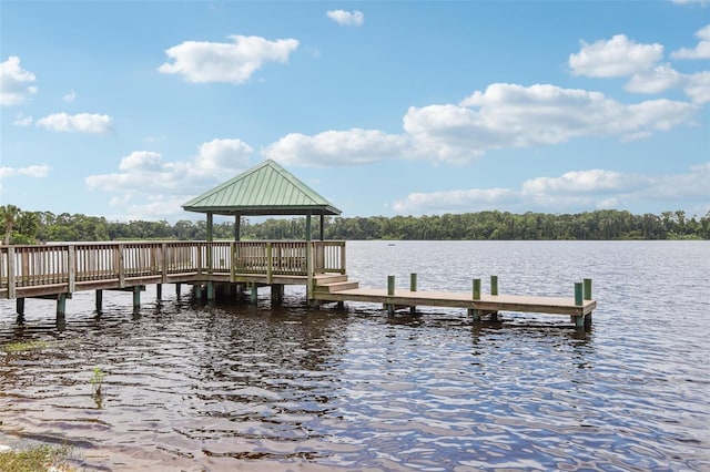 dock area with a gazebo and a water view