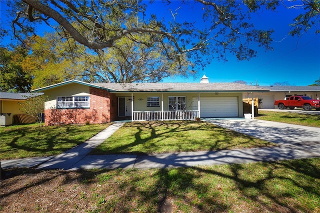 ranch-style home with brick siding, an attached garage, driveway, and a front lawn