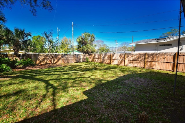 view of yard with a fenced backyard