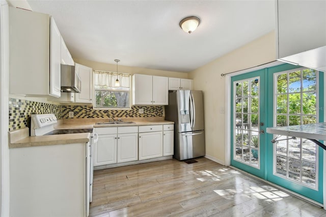 kitchen featuring french doors, tasteful backsplash, stainless steel refrigerator with ice dispenser, and white electric range oven