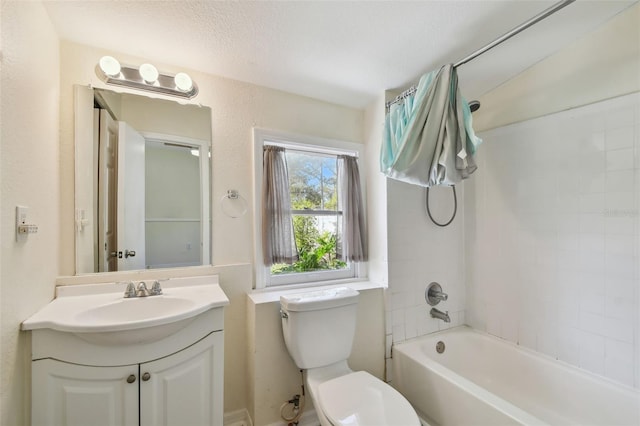 bathroom featuring shower / tub combination, toilet, and vanity