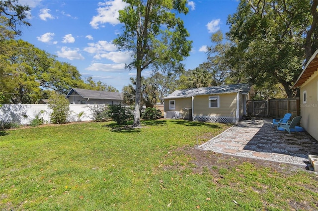 view of yard featuring a patio and a fenced backyard