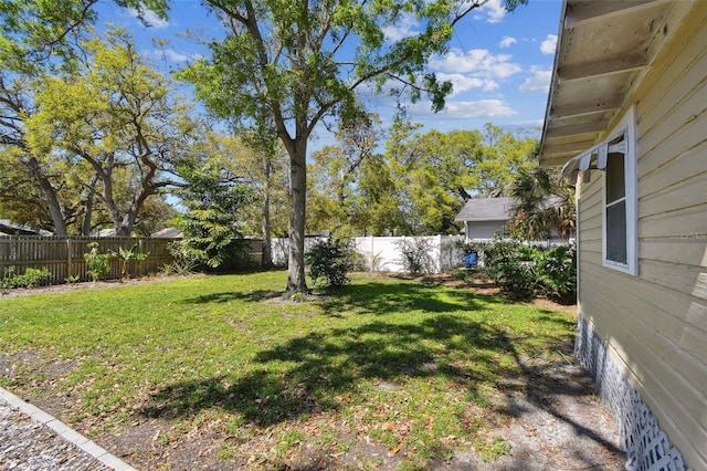 view of yard with a fenced backyard