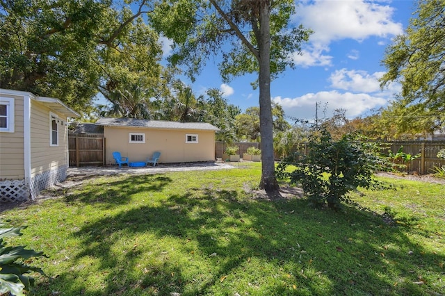 view of yard featuring an outbuilding and a fenced backyard