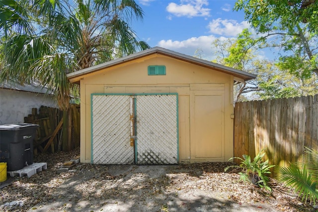 view of shed with fence