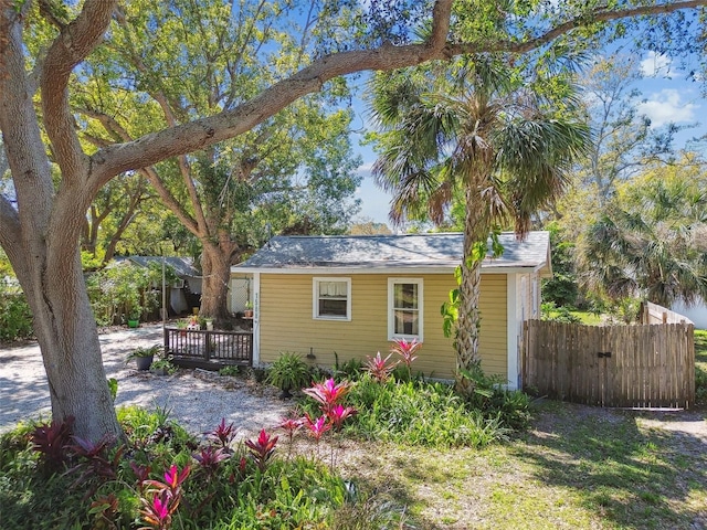 view of front of property featuring a deck and fence