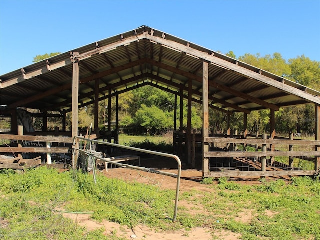 view of community featuring an outbuilding, an exterior structure, and a detached carport