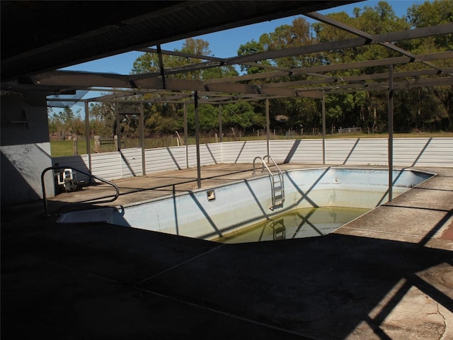 view of pool featuring a lanai, an empty pool, and a patio