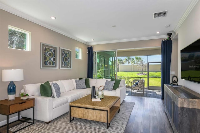 living area featuring recessed lighting, visible vents, wood finished floors, and crown molding