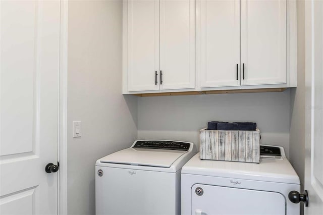 laundry area featuring cabinet space and washer and clothes dryer