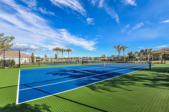 view of sport court with fence