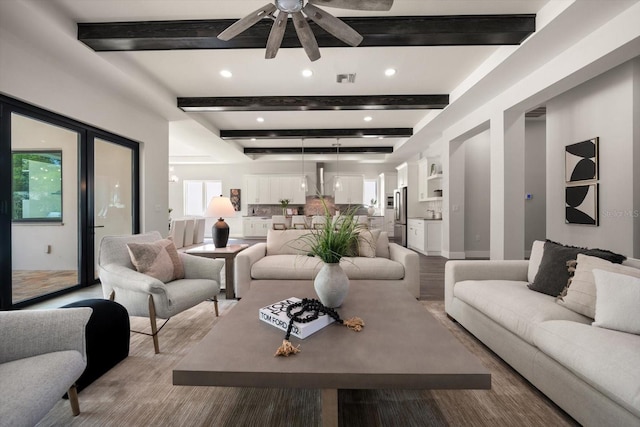 living room featuring recessed lighting, beamed ceiling, visible vents, and a ceiling fan