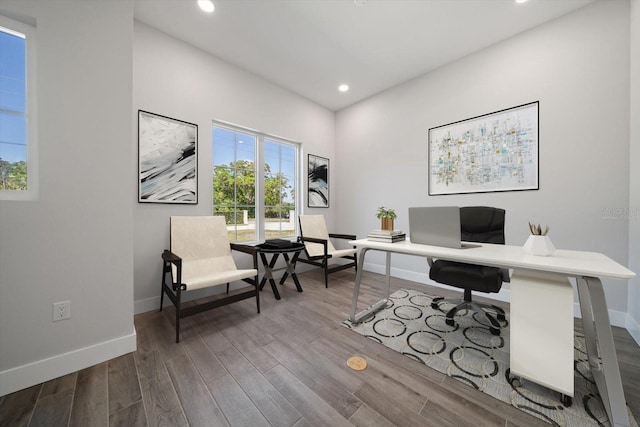 home office featuring recessed lighting, wood finished floors, and baseboards