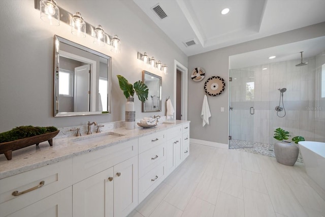 bathroom with a sink, visible vents, double vanity, and a shower stall