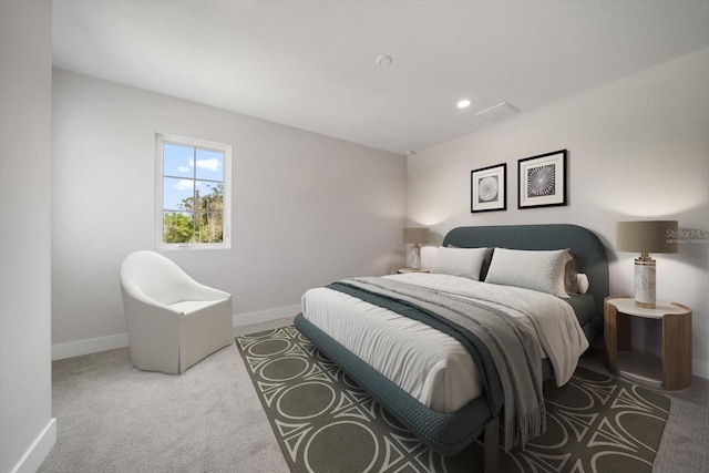 carpeted bedroom featuring recessed lighting and baseboards