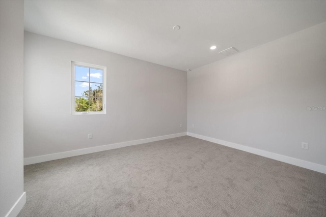 unfurnished room featuring recessed lighting, baseboards, and carpet floors