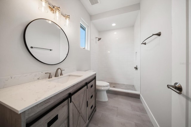 full bath featuring visible vents, baseboards, toilet, a tile shower, and vanity