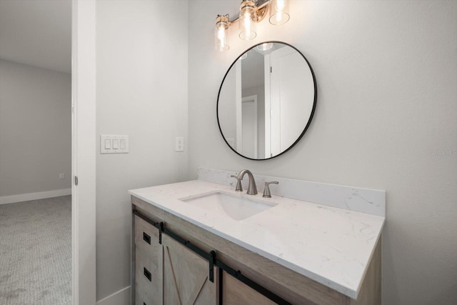 bathroom featuring vanity and baseboards