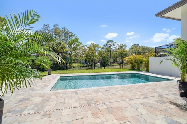 view of swimming pool featuring a patio, fence, and a fenced in pool