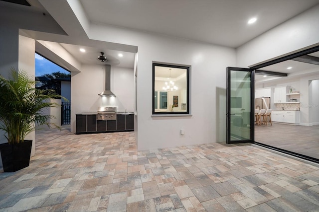 interior space with grilling area and an outdoor kitchen