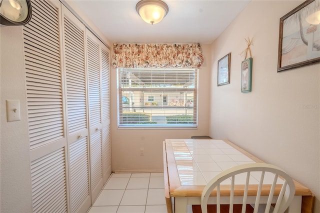 dining room featuring light tile patterned flooring