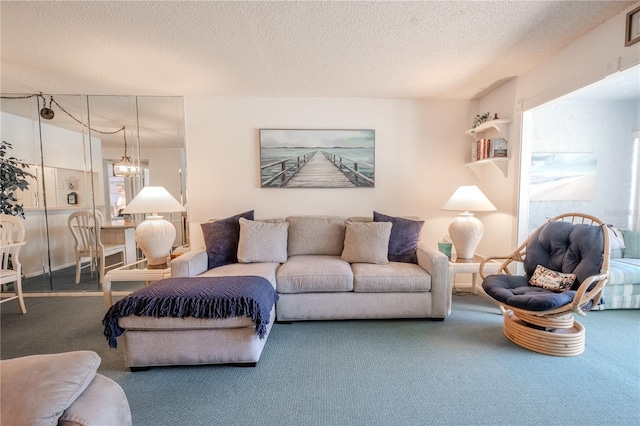 carpeted living room with a textured ceiling