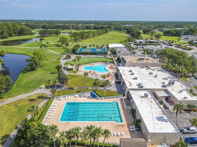 aerial view featuring a water view and golf course view