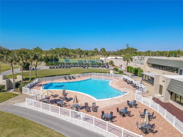 pool featuring a patio and fence