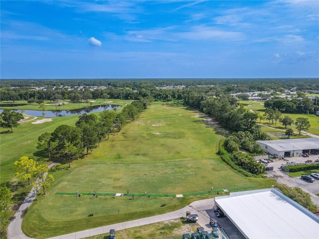 drone / aerial view featuring a water view and view of golf course