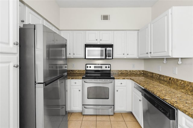 kitchen featuring white cabinetry, visible vents, light tile patterned floors, and appliances with stainless steel finishes