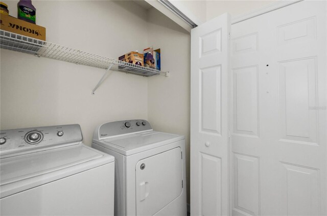laundry room featuring independent washer and dryer and laundry area