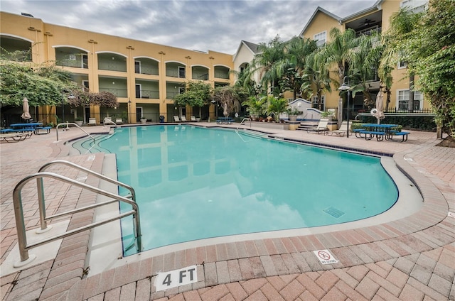 community pool with a patio