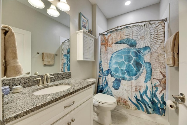 bathroom with vanity, tile patterned floors, toilet, and a shower with shower curtain