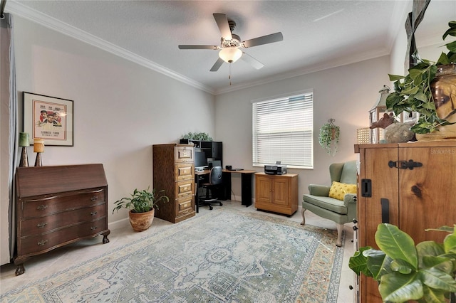 office area featuring ceiling fan, a textured ceiling, baseboards, and ornamental molding