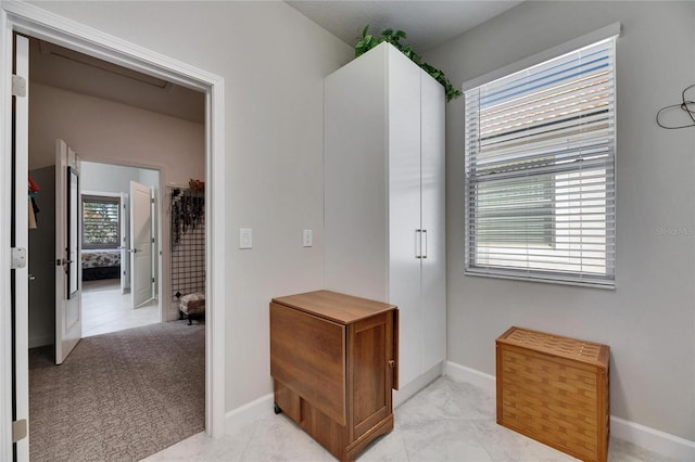 interior space featuring baseboards